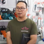 A man wearing glasses and a printed t-shirt