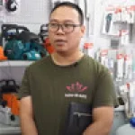 A man wearing glasses and a printed t-shirt